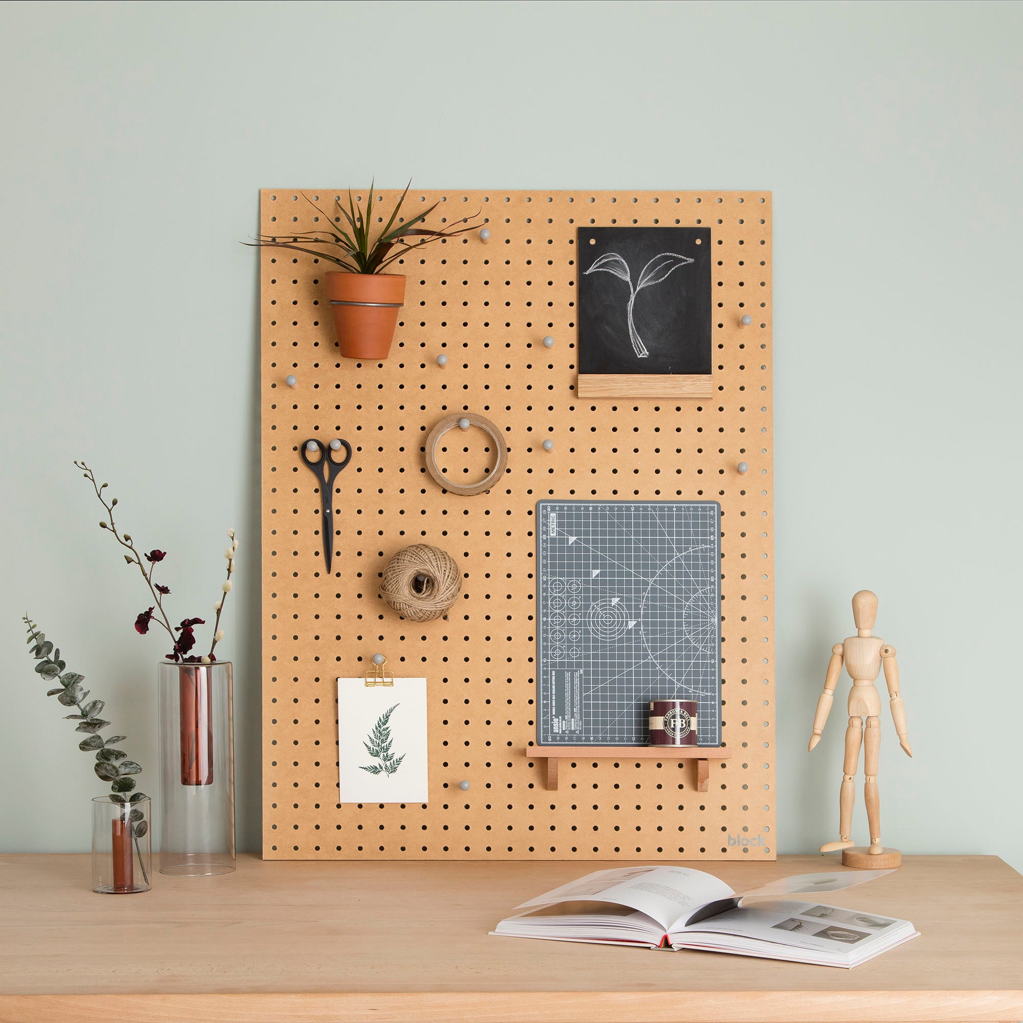 Large natural pegboard display with pegboard accessories