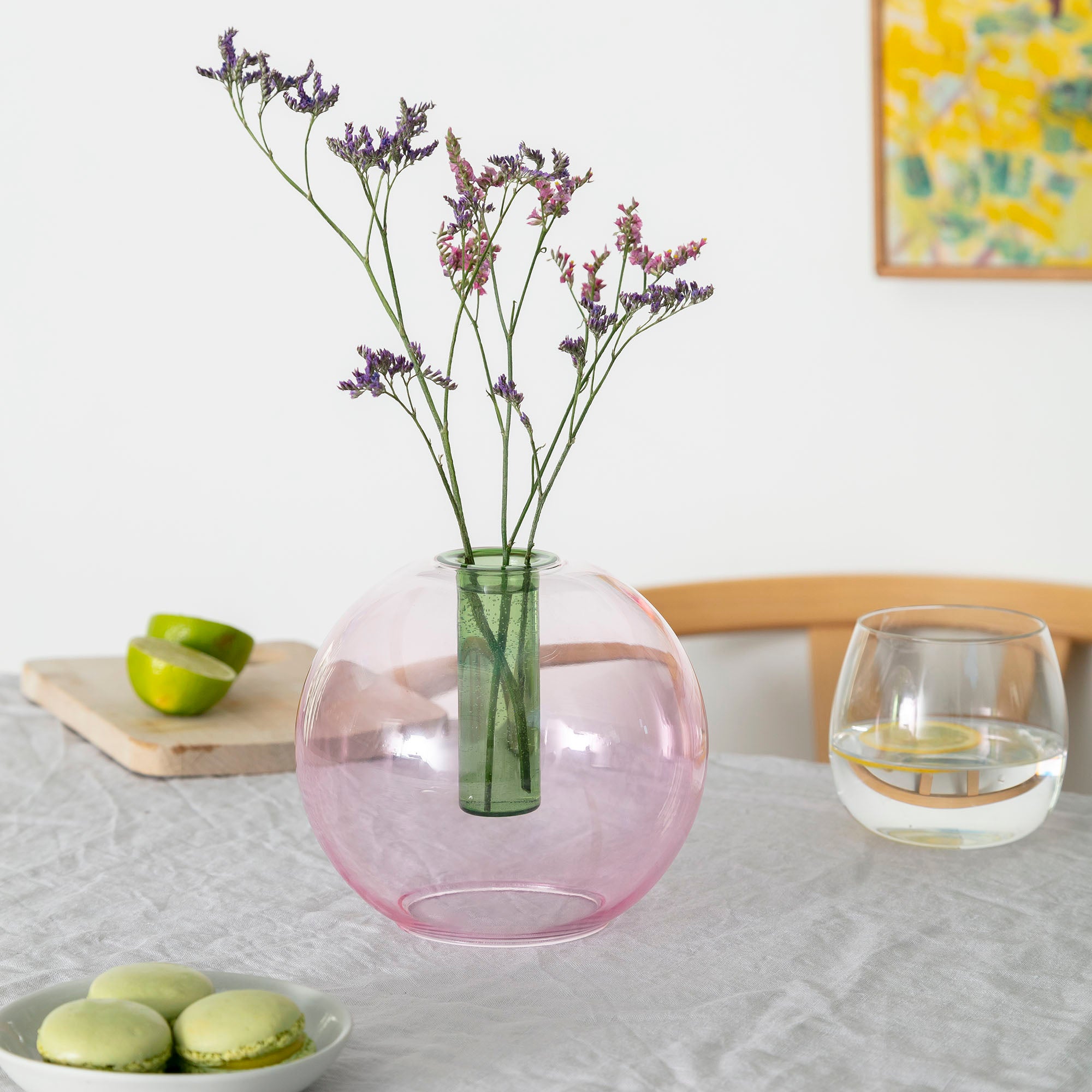 pink coloured glass vase with reversible use for flowers