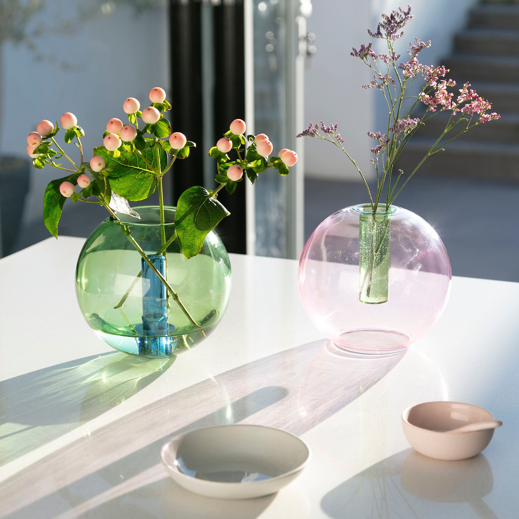 pink and green glassware vases with reversible use for flowers