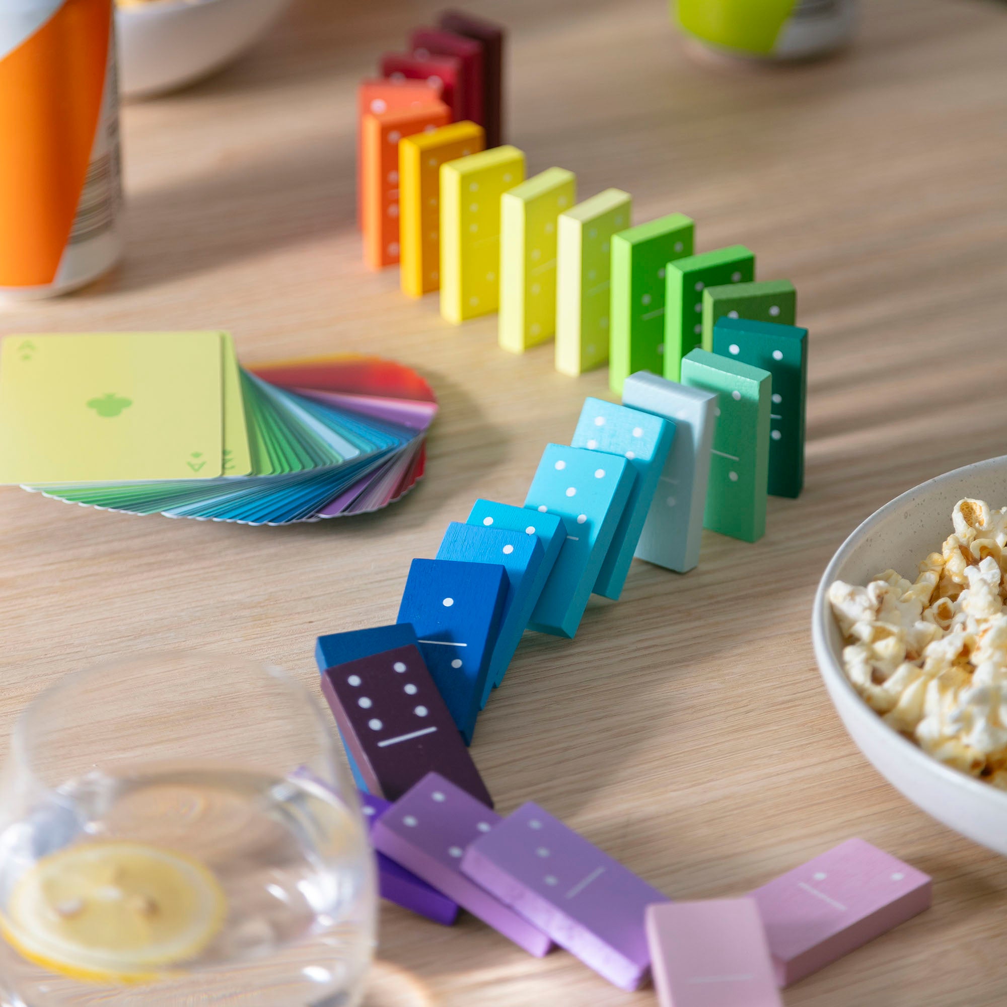 Domino rally in a rainbow colour gradient