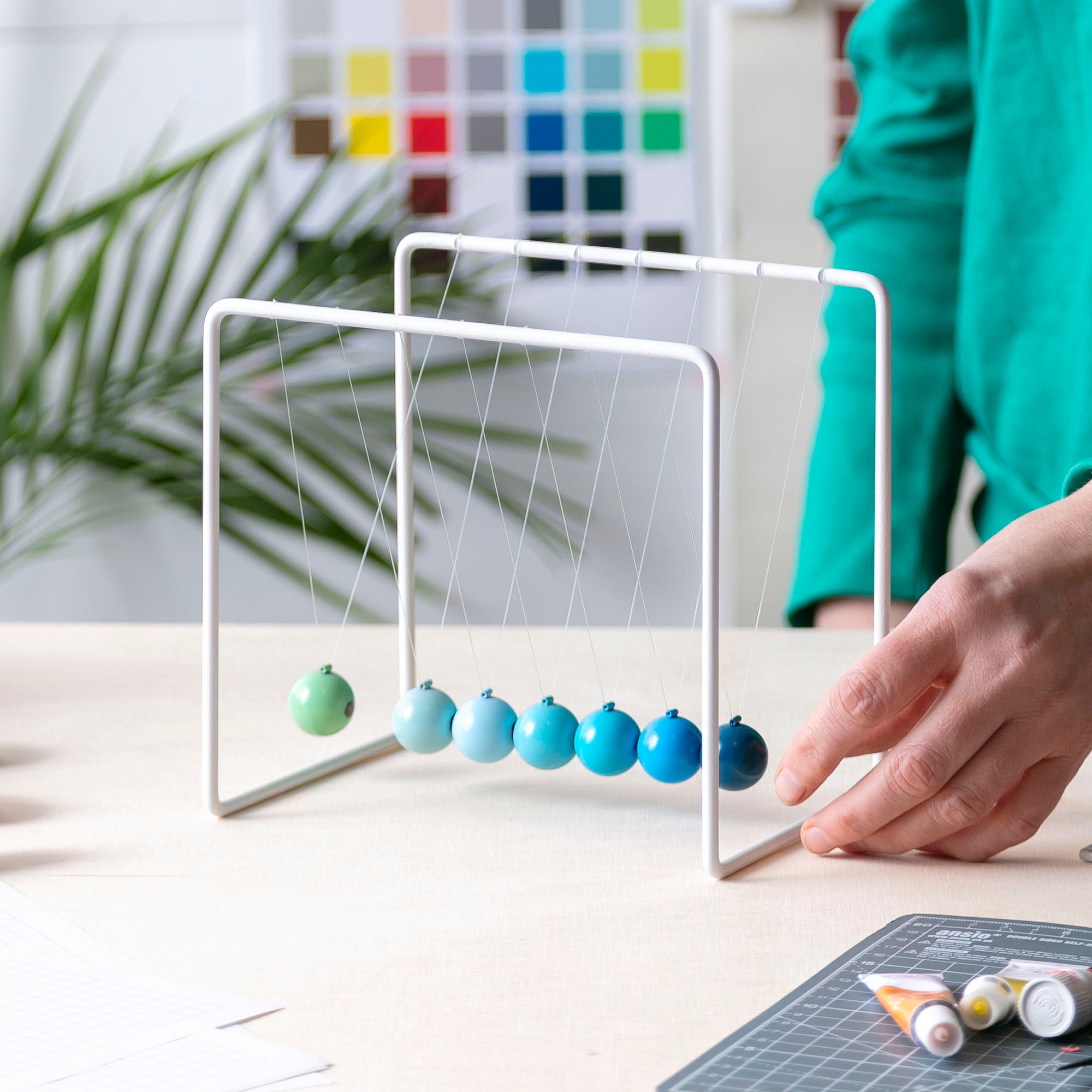 Newton's cradle on design studio desk