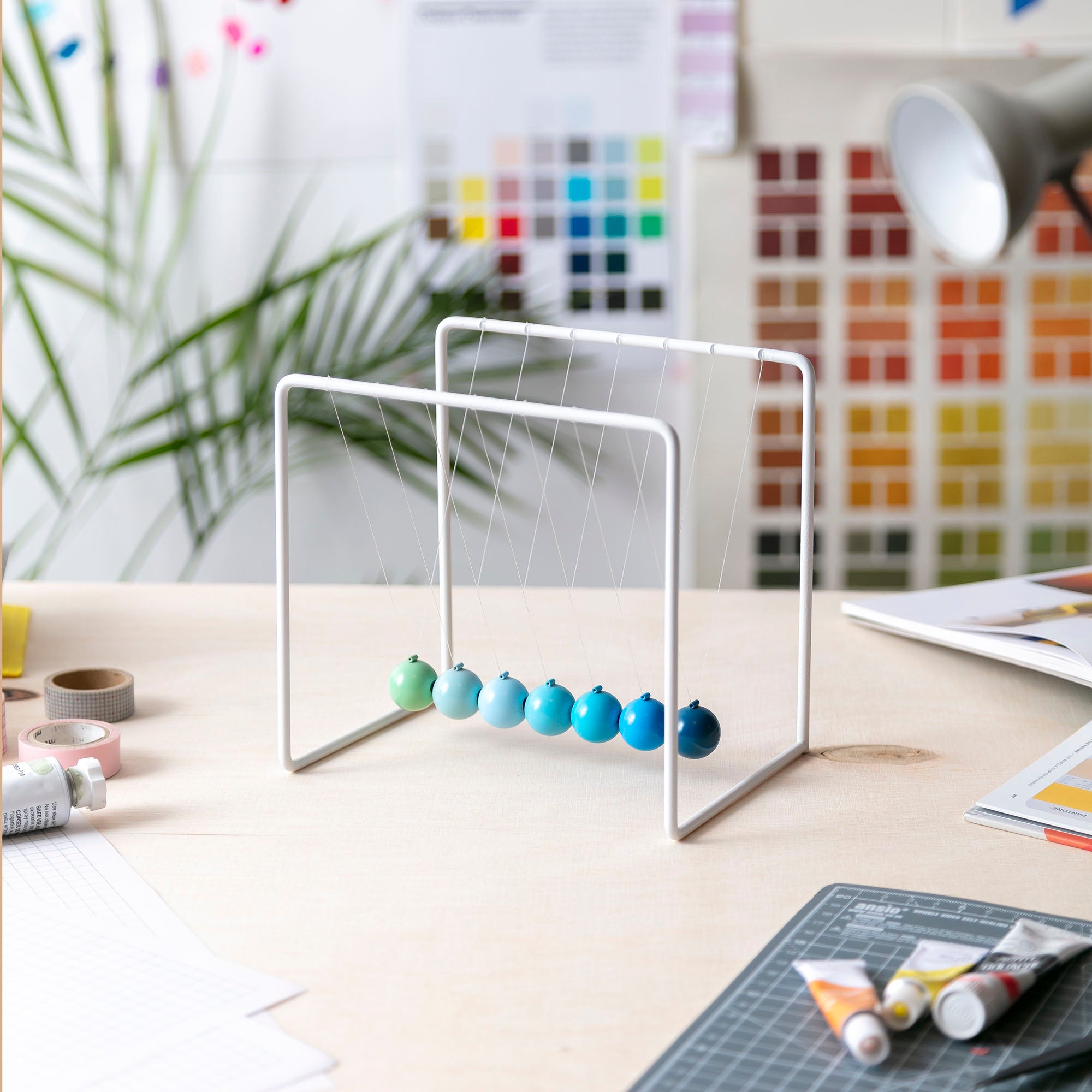 Newton's cradle in design studio desk