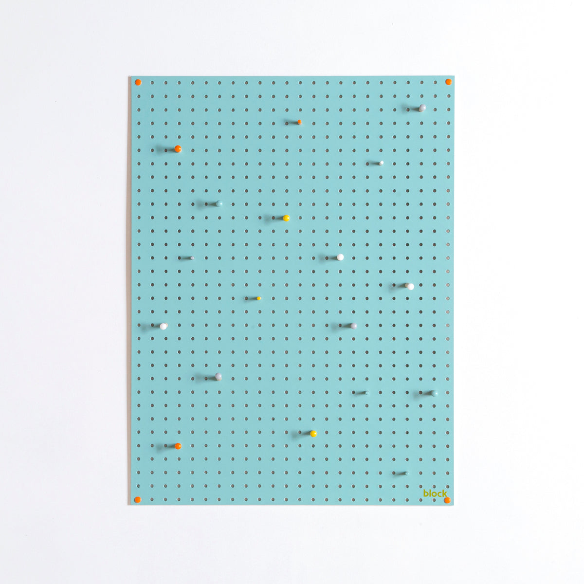 large blue display pegboard with painted wooden pegboard pegs