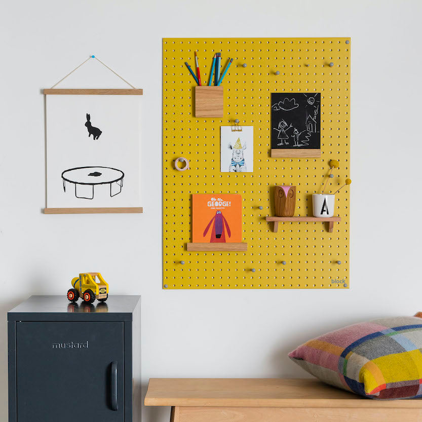 wall mounted yellow pegboard and wooden pegboard accessories